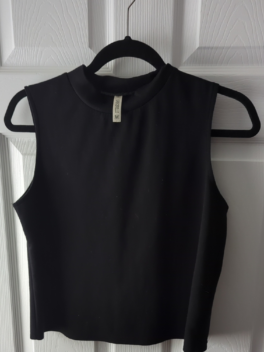 Grecerelle Black Sleeveless Mock Neck Top